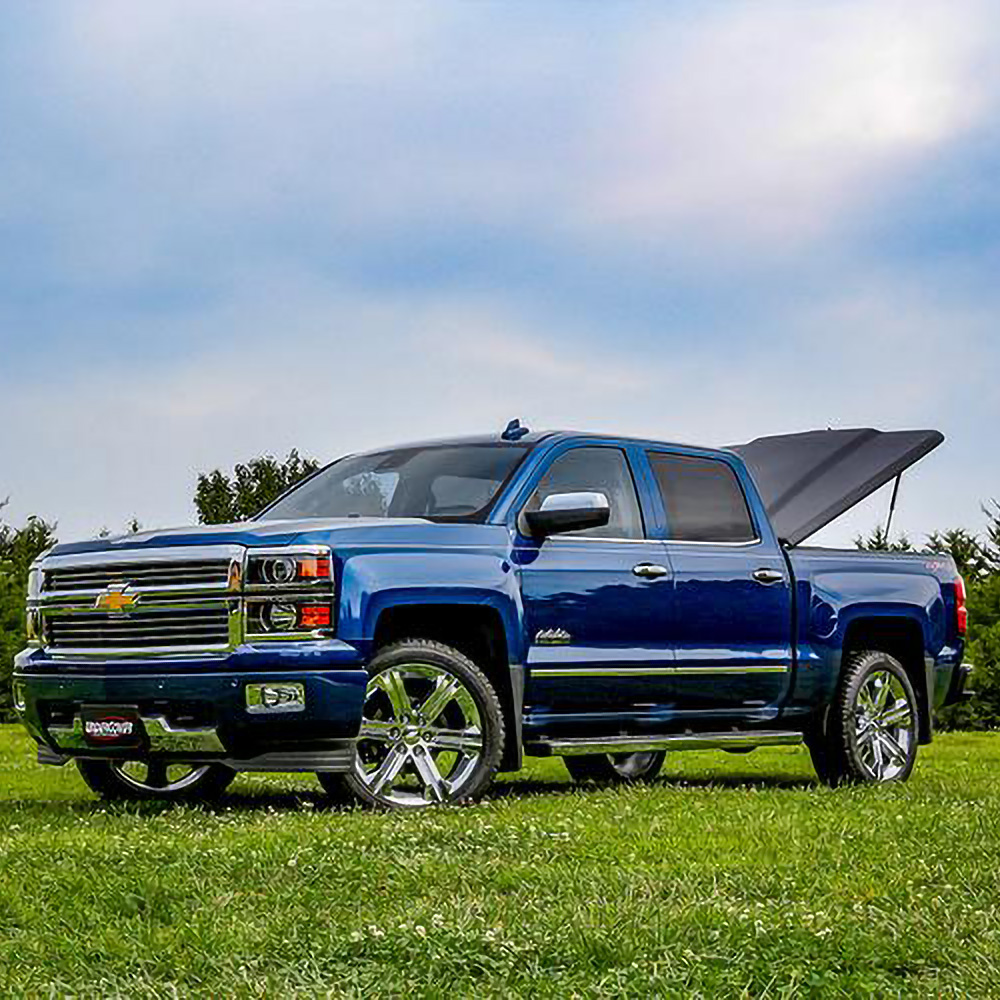 Hinged truck bed covers